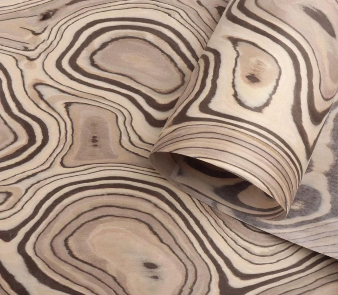 Architectural furniture with designer veneer showcasing controlled grain patterns and expressive material composition