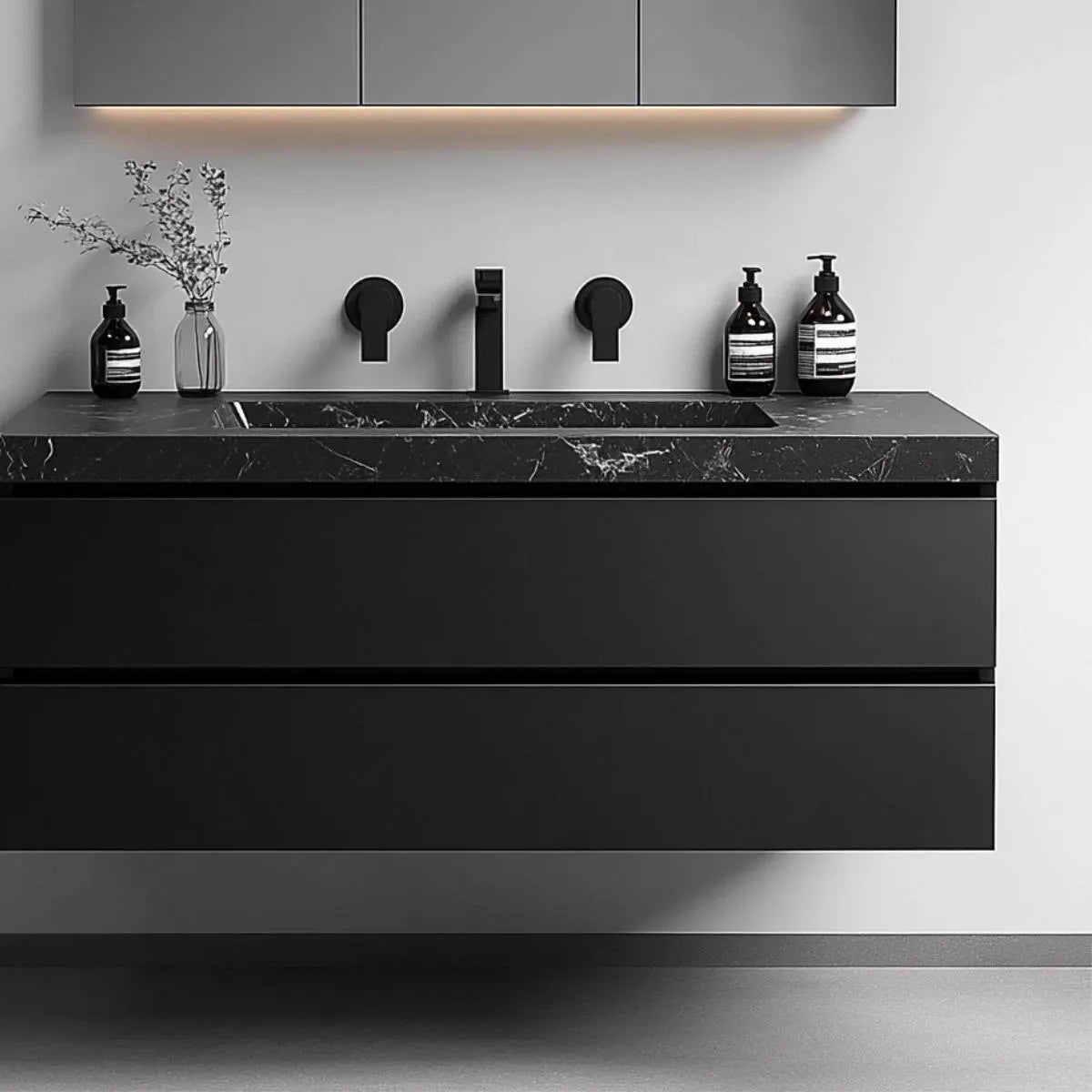 Matte black floating bathroom vanity with handleless drawers and minimalist design.
